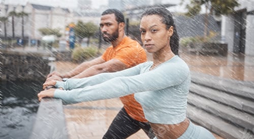 Preview: Exercise, couple in the rain and stretching for workout, fitness and wellness. Wet, man or woman t