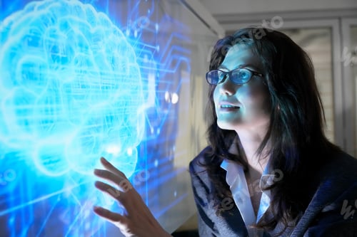 Preview: Woman interacts with digital brain display in tech office during day
