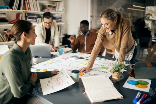Preview: Happy creative business team working on a new project in the office.