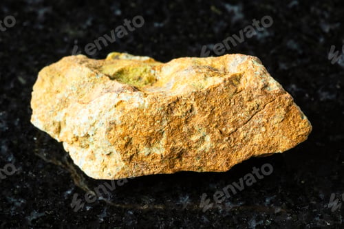 Preview: sample of raw beaverite-cu rock on black granite