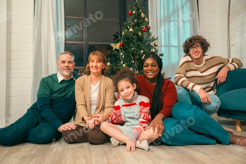 Preview: family, winter holidays and people concept - happy mother, little daughter decorating Christmas