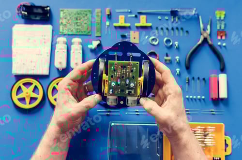 Preview: Hands holding a toy motherboard