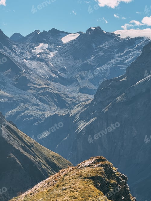 Preview: Alpine landscape showing mountain valley and glacier under blue sky