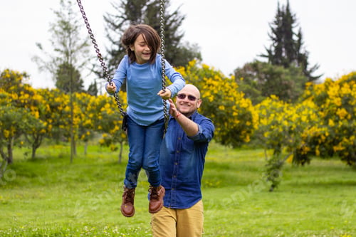 Preview: dad-and-daughter-playing-on-swing