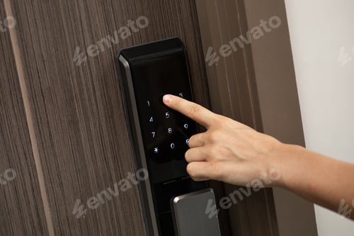 Preview: Hand and digital smart code lock into the modern apartment
