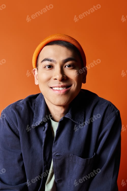 Preview: The bold blue shirt and orange hat
