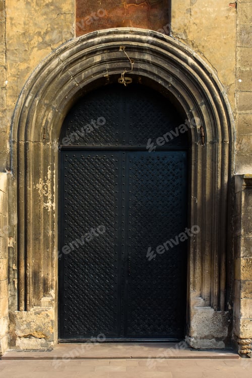 Preview: Metal rusted old big gate of ancient castle. Although the gates are old, people still use them