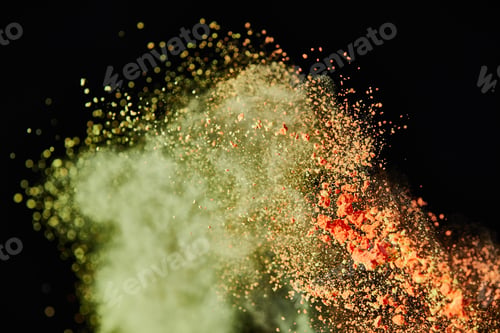 Preview: cosmetic brush with colorful yellow and orange powder explosion on black background