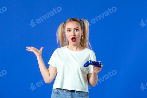 Preview: front view young female with gamepad on blue background joyful player adult sofa online winning