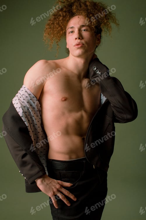 Preview: Attractive And Stylish Guy With Curly Hair And A Sports Figure