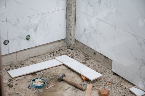 Preview: Repairing wall of bathroom with tiling marble tile and tools