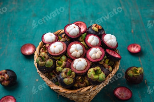 Preview: Mangosteen fruit on light blue wooden background,Tropical fruit