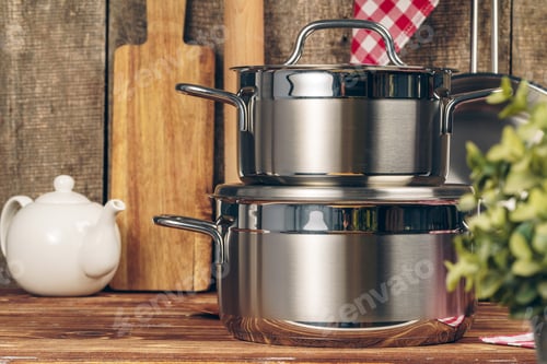 Preview: Set of stainless steel saucepans in a kitchen