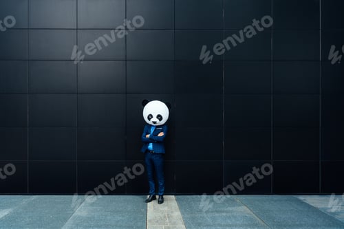 Preview: Storytelling image of a business man wearing a giant panda head