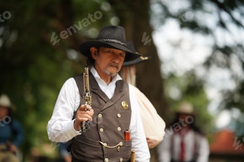 Preview: Brutal cowboy with revolver, gunfight on ranch, rural background.