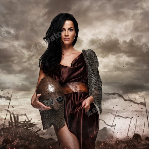 Preview: Attractive war queen holding helmet in fire sparks.