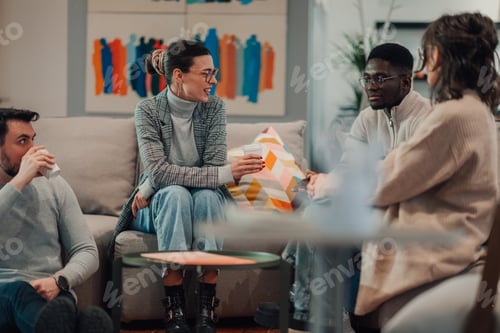 Preview: Creative team discussing new project during coffee break in modern office