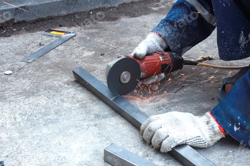 Preview: Worker Cutting The Metal Bar