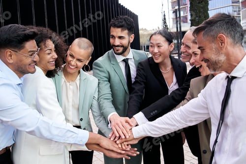 Preview: Multicultural happy business group team building team joining hands. Smiling diverse professional.