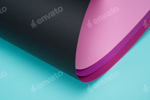 Preview: roll of black and pink paper on turquoise