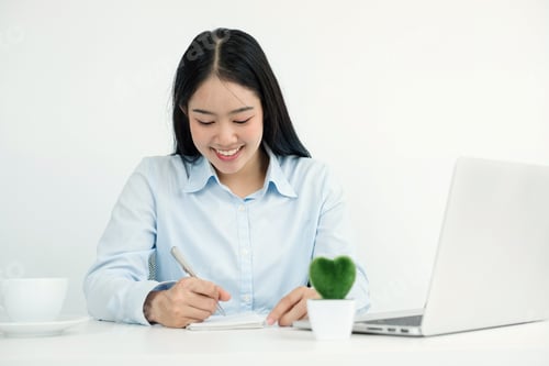 Preview: Asian woman working laptop. Successful smiling businesswoman sitting working and take note