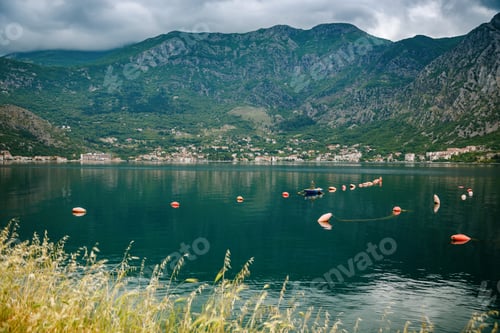 Preview: The lonely fisherman fishing in his boat along the beautiful coastline of Boka Kotor bay