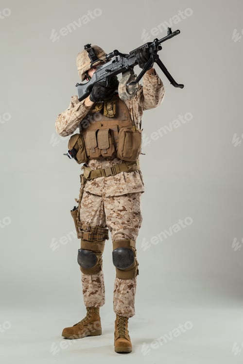 Preview: Soldier in combat uniform aiming weapon during training session indoors