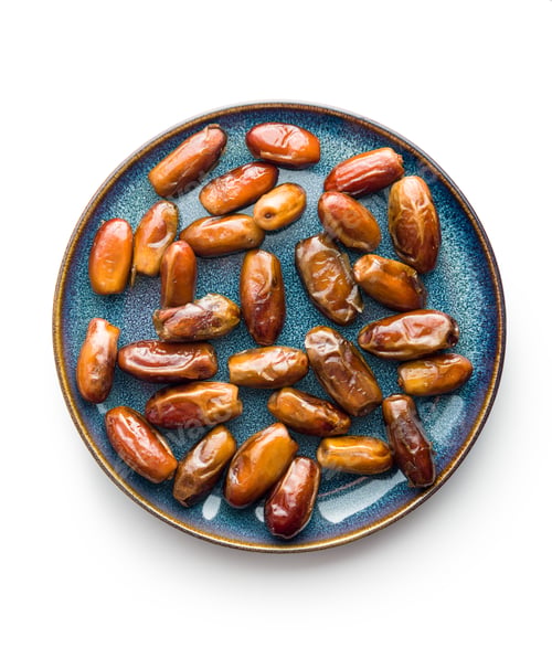 Preview: Dried dates fruit on plate isolated on white background.