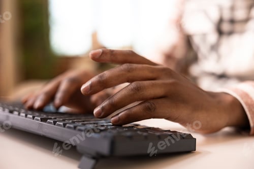 Preview: Black entrepreneur Typing Business Emails