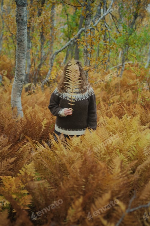 Preview: Caucasian woman standing amongst a dead yellow ferns