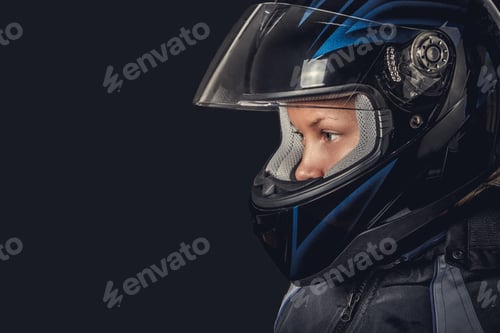 Preview: Female in motorcycle safety costume and black helmet.