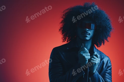Preview: Portrait of fashion man with curly hair on red background with stylish glasses, multicultural