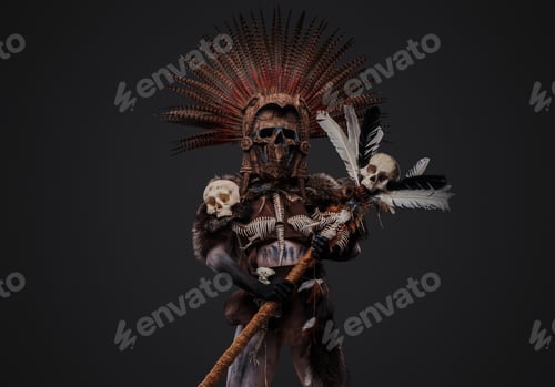 Preview: Antique shaman with painted face and body holding staff