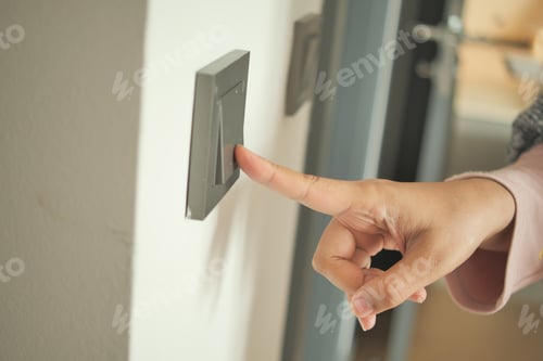 Preview: women finger turning on lighting switch .