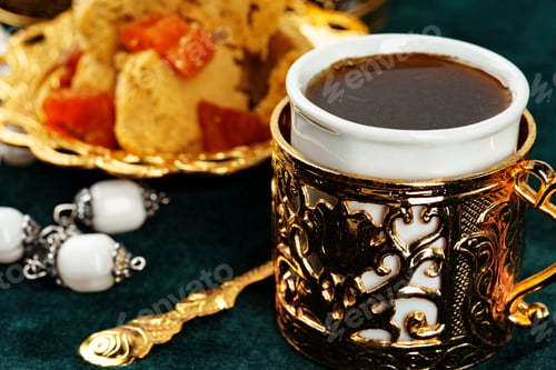 Preview: Turkish tea with oriental desserts on table