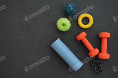 Preview: Fitness equipment and healthy snacks arranged for workout