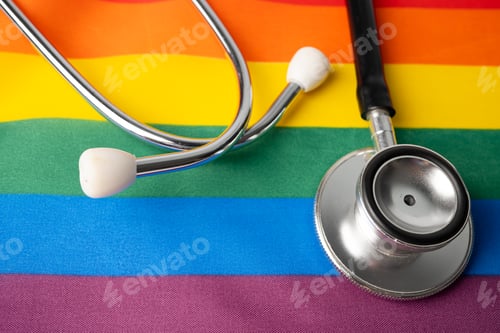 Preview: Black stethoscope on rainbow background, symbol of LGBT pride month celebrate annual in June.