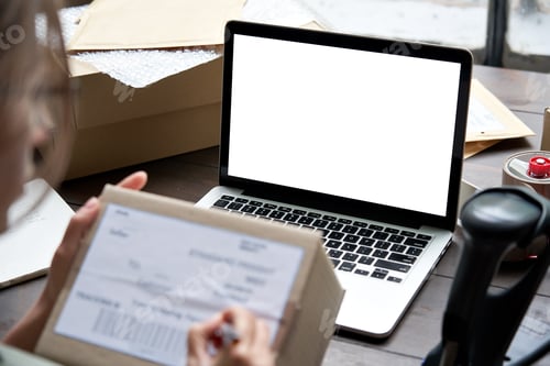 Preview: Female seller selling ecommerce shipping box checking online store order.