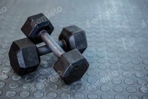 Preview: Two dumbbells lying on top of each other on the floor in crossfit gym