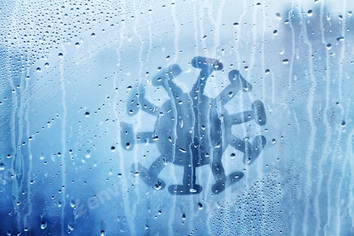 Preview: coronavirus molecule figure is painted on wet blue window with raindrops