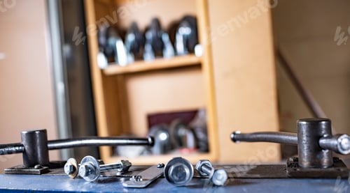 Preview: Metal chrome bolts and nuts on manual flexible massive machine
