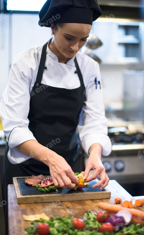 Preview: female Chef preparing beef steak
