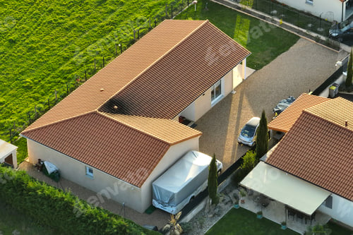 Aperçu: Aerial view of residential houses in green suburban rural area