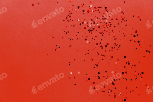 Preview: Colorful of confetti on red background. Brilliant colored sequins. Holiday greeting card