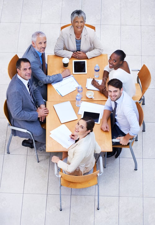 Preview: High angle view of a group of businesspeople having a meeting at a conference table
