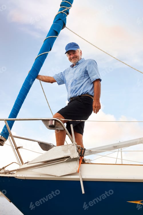 Preview: Seasoned sailor standing proudly on his boat