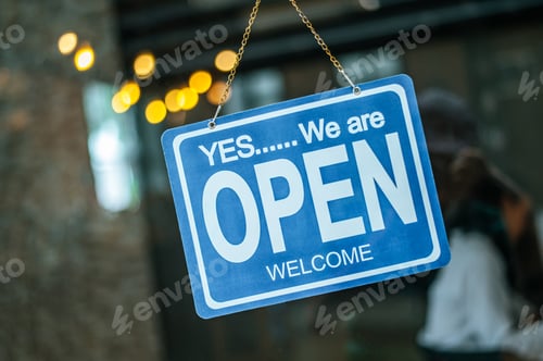 Preview: open sign broad through the glass of window at coffee shop