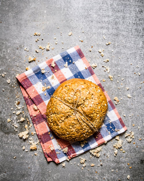 Preview: Fresh loaf with bread crumbs . Top view