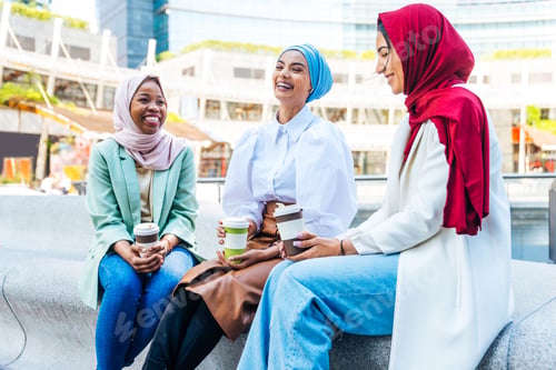 Preview: Beautiful muslim girl wearing hijab bonding outdoors
