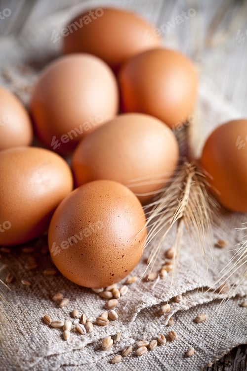 Preview: fresh brown eggs, wheat seads and ears